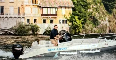 Self-drive boat rental on Lake Como with no license required, passing lakeside villas